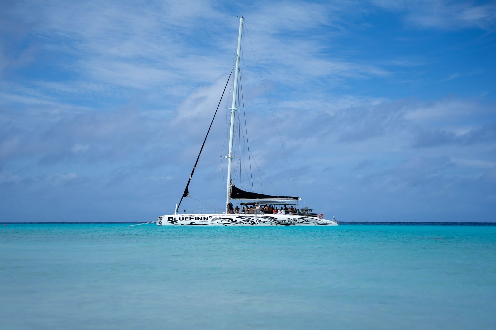 Catamaran sailing in turquoise Caribbean water