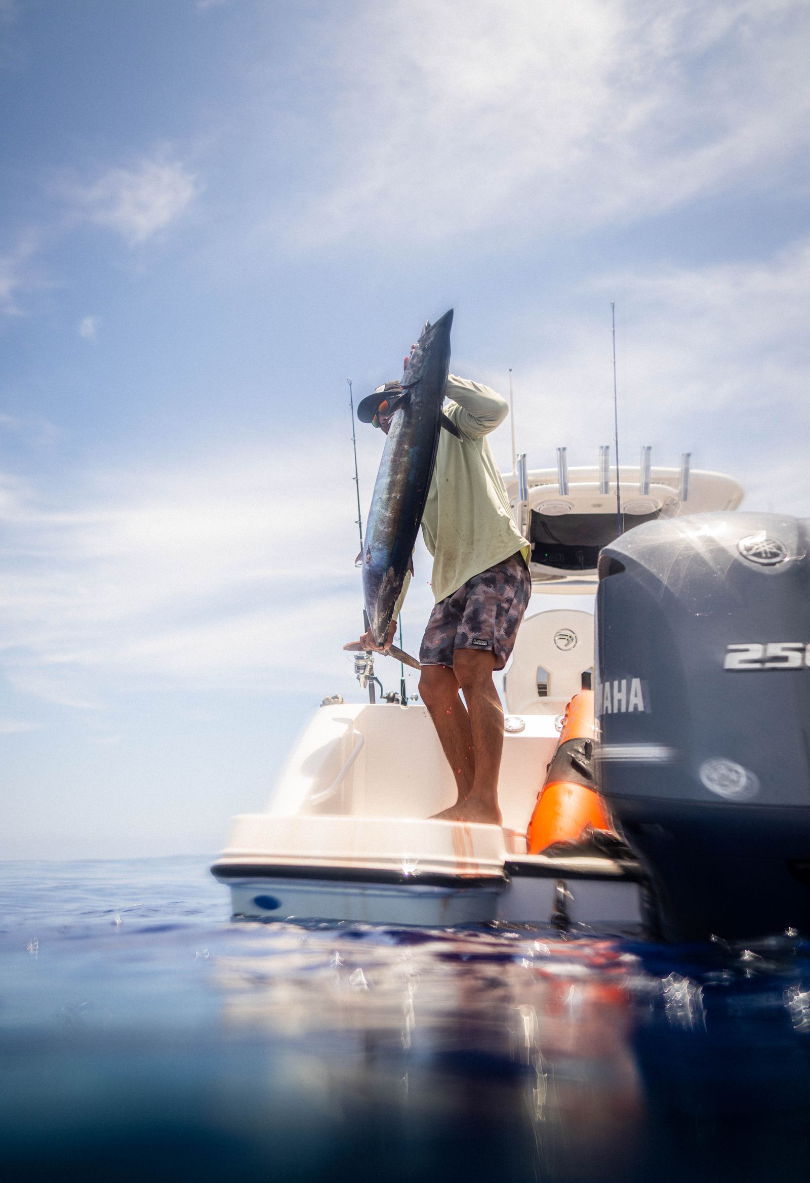 Angler holding a catch from a deep sea fishing trip